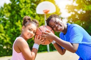 A,Portrait,Of,Brother,And,Sister,Basketball,Player,Standing,At