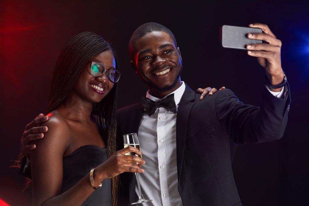 Young African-American Couple Taking Selfie at Party